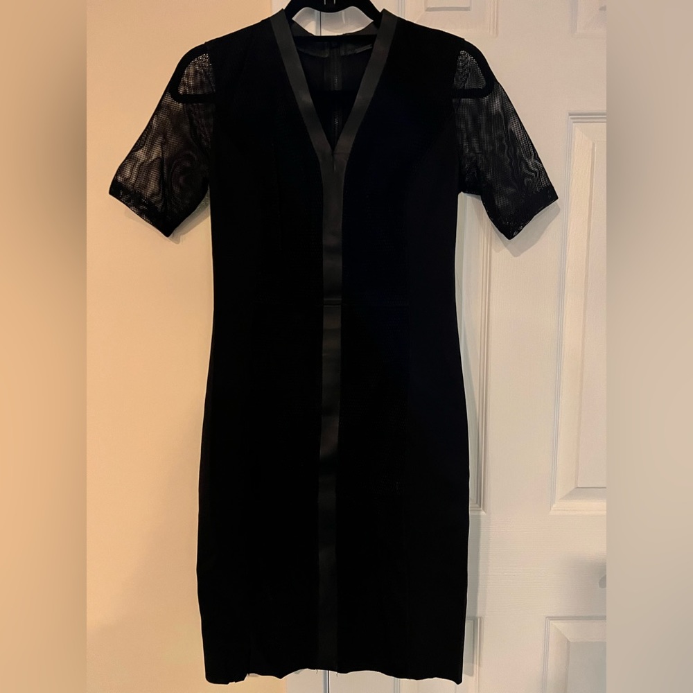 Elie Tahari black dress with short mesh sleeves and suede & leather accents